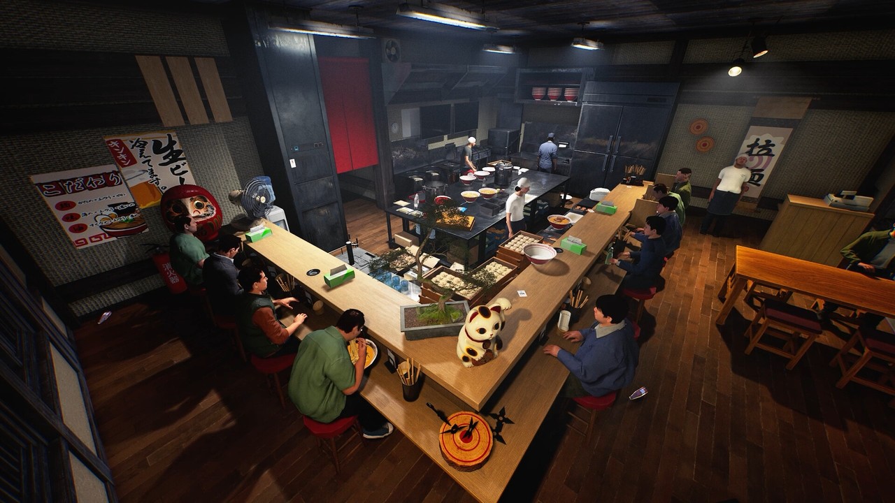 A high view of the shop counter, red stools, a red noren, and wooden tables.